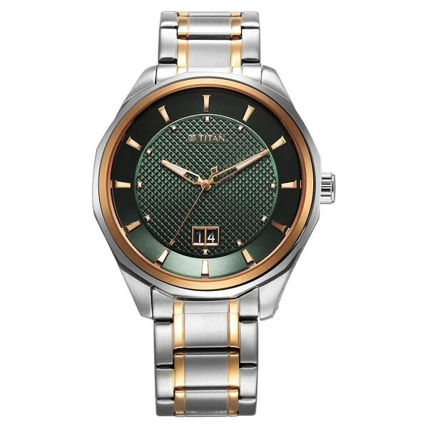 a silver and gold watch with a green dial