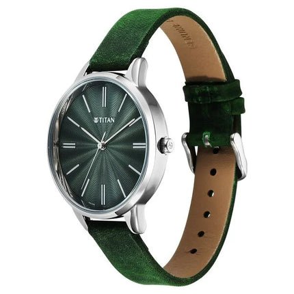 a green watch with a leather strap
