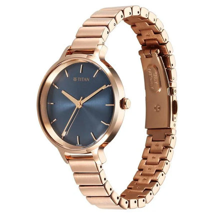 a gold watch with a blue dial on a bracelet
