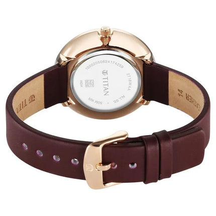 a women's watch with a brown strap