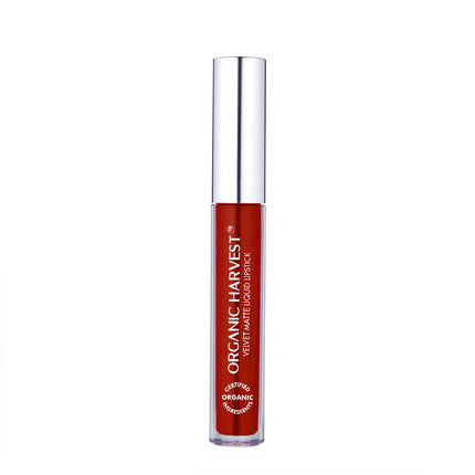 User holding Organic Harvest Velvet Matte Liquid Lipstick, illustrating its appeal as a popular organic liquid lipstick alternative.