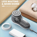 Wireless usb rechargeable fabric shaver electric with a transparent body gray accents and perforated top cap