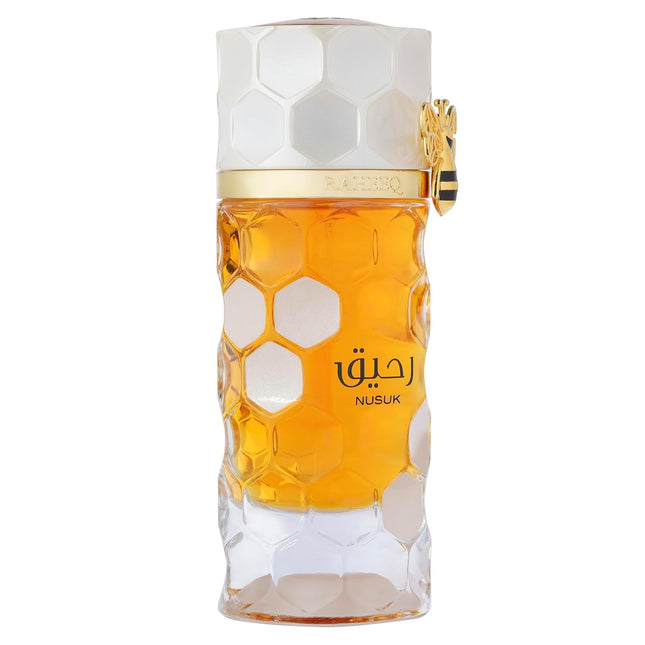 Close-up of NUSUK Raheeq Perfume featuring citrus vanilla fragrance notes in a luxurious packaging.