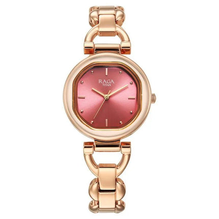 Titan Raga Showstopper Quartz Analog Watch with a pink dial and rose gold metal strap, showcasing a stylish design suitable for women.