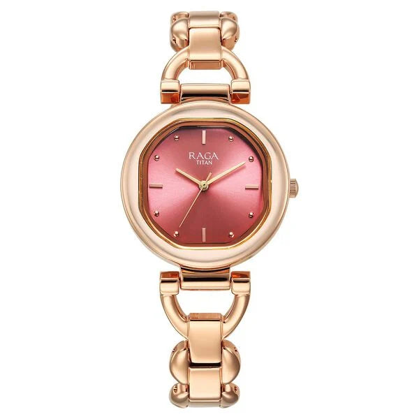 Titan Raga Showstopper Quartz Analog Watch with a pink dial and rose gold metal strap, showcasing a stylish design suitable for women.
