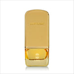 a bottle of perfume sitting on top of a white surface