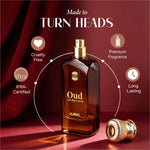 A sleek amber glass ajmal oud on the rocks eau perfume bottle with gold spray nozzle featuring smoky oud scent