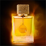 a bottle of perfume sitting on top of a table