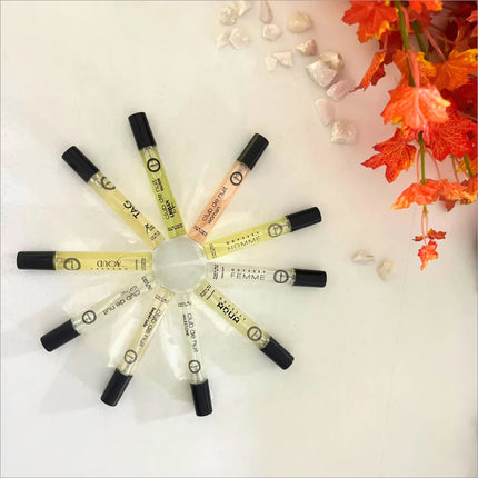 An arrangement of colorful perfume vials from the Armaf Discovery Set - Premium Luxury Fragrance (7ML x 24 PCS) Long-Lasting Fragrance for Men & Women, highlighting the travel perfume set's variety. Managed by Armaf, this new collection makes an excellent choice for fragrance enthusiasts.