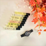 The top view of the Armaf Discovery Set - Premium Luxury Fragrance (7ML x 24 PCS) Long-Lasting Fragrance for Men & Women highlights various miniature bottles elegantly arranged. This exceptional travel perfume set by Armaf is perfect for gifting or personal indulgence, marking it as a new luxury experience.