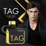a man with a black shirt and black jacket next to a bottle of tag