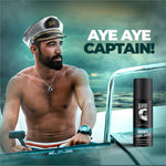a man in a sailor's hat is next to a car