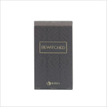 Close-up of the Bewitched EDP packaging, displaying the sophisticated black box design with gold lettering, featuring the product name 'BEWITCHED' and brand 'BIRRA'.