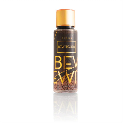 Bottle of Bewitched Body Mist by BIRRA, featuring a black and gold design with the product name prominently displayed in bold letters.