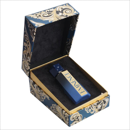 Open box revealing the BIRRA Eminence Premium Perfume, featuring a beautifully designed dark blue bottle nestled in soft black cushioning, emphasizing luxury.