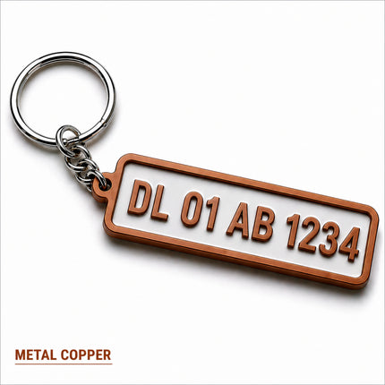 Copper-colored metal custom number plate keychain with raised lettering for personalized car enthusiast accessories