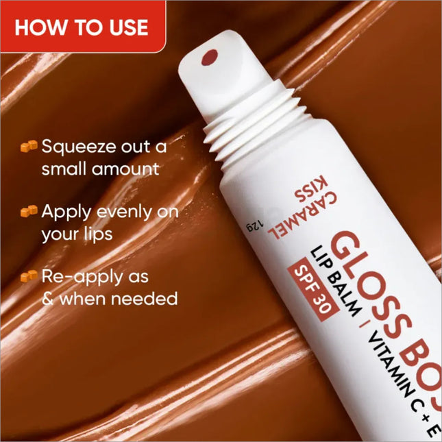Close-up of Dot and Key Gloss Boss Vitamin C + E Lip Balm with SPF 30 in Caramel Kiss shade, showcasing its texture as a moisturizing lip balm with SPF.