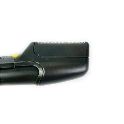 Black plastic electric trimmer with yellow power button and metallic blades in multifunctional grooming kit hair trimmer
