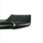 Black plastic electric trimmer with yellow power button and metallic blades in multifunctional grooming kit hair trimmer