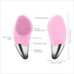 Pink silicone facial cleansing brush with metallic silver tip and textured bristles for deep skin cleansing and soothing