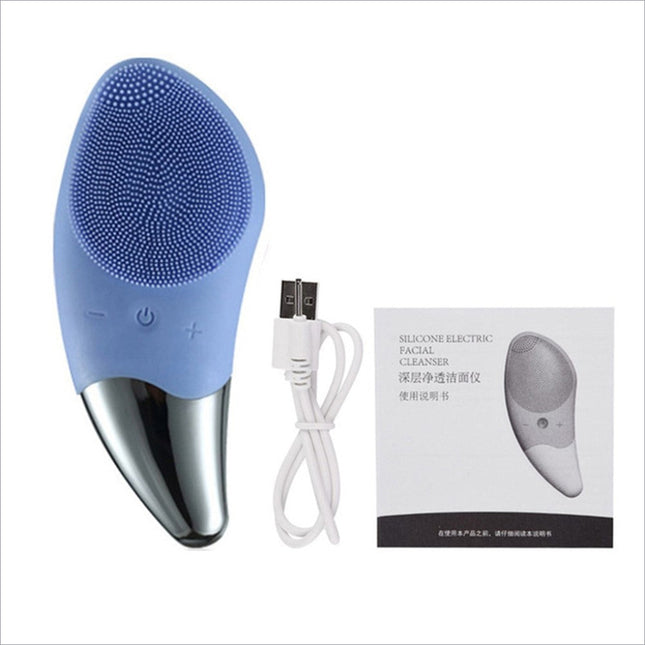 Light blue silicone facial cleansing brush with metallic silver tip and textured bristles for deep cleaning