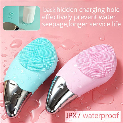 A sleek metallic silver facial cleansing brush with a soft silicone head and five speed sonic vibrating scrubber