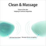 A mint green facial cleansing brush silicone beauty massager with soft bristle head and massage ridges for deep cleaning