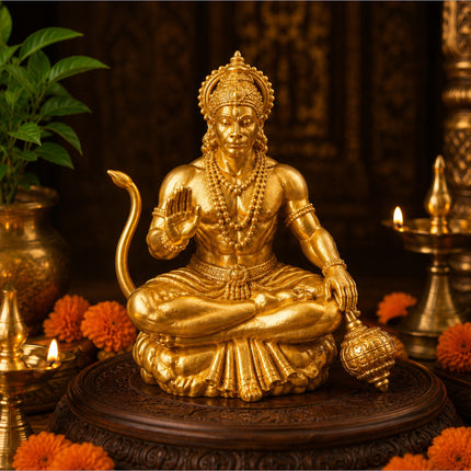 Golden hanuman ji idol with intricate detailing and traditional crown meditating on ornate wooden base for home temple bajrangbali murti