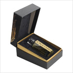 Open box showing a smaller bottle of Influence premium perfume by BIRRA resting on a luxurious black velvet interior. The bottle has a classic design with the name 'INFLUENCE' labeled on it.