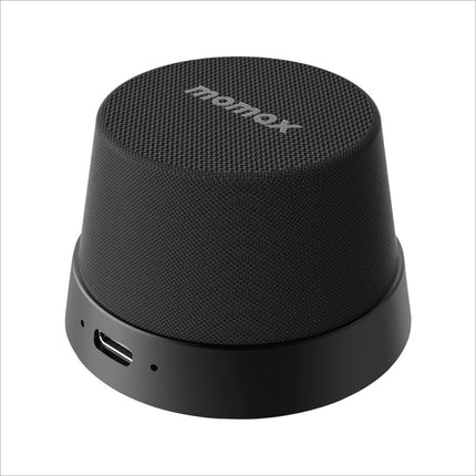 Black textured momax bs6 magnetic wireless speaker with sleek cylindrical design and usb-c charging port for portable use
