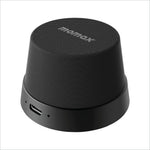 Black textured momax bs6 magnetic wireless speaker with sleek cylindrical design and usb-c charging port for portable use