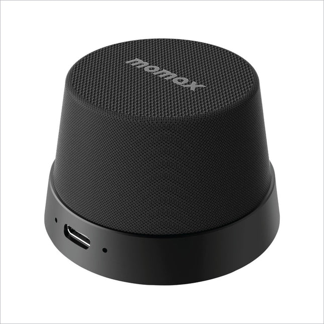 Black textured momax bs6 magnetic wireless speaker with sleek cylindrical design and usb-c charging port for portable use