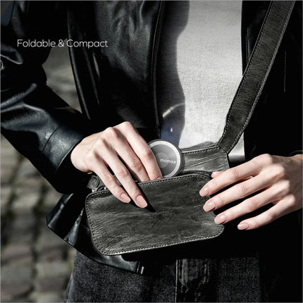 Black leather wallet with silver momax logo shown alongside electric magnetic phone stand 360 rotation holder
