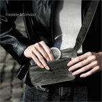 Black leather wallet with silver momax logo shown alongside electric magnetic phone stand 360 rotation holder