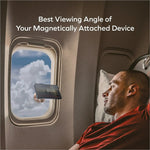 Black smartphone mounted on momax kh20 electric magnetic phone stand auto suction holder in airplane cabin window