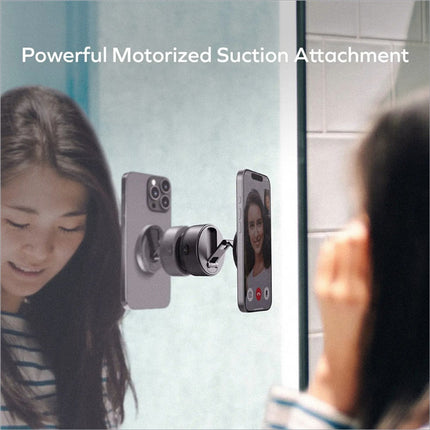 Black motorized suction electric magnetic phone stand auto holding two smartphones on mirrored surface