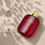 A sleek deep red glass bottle of next golden dragon perfume with a polished gold cap ideal for skin care fragrance
