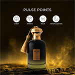 A dark glass perfume bottle with a gold cap and tassel labeled olive oud by next for skin care fragrance