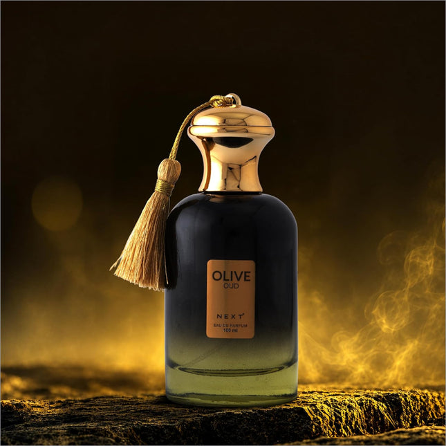 A luxurious dark glass olive oud perfume bottle by next with a golden cap and tassel for skin care use
