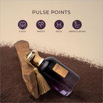 A dark purple glass perfume bottle with a gold cap and tassel labeled velvet gold by nexy for velvet oud eau perfume