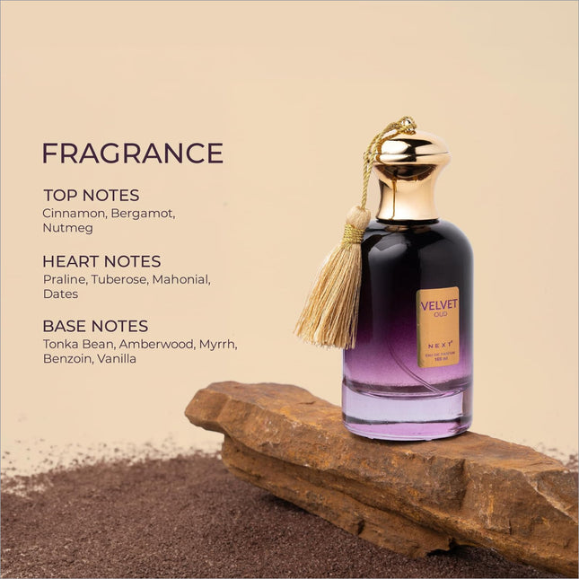A sleek dark purple to light lavender gradient velvet oud perfume bottle with a gold cap and tassel by next