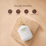 White ceramic perfume bottle with gold crown cap and vertical ridges labeled white oud next for skin care use