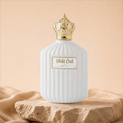 White oud perfume in a white ceramic bottle with gold crown cap and ribbed texture for skin care use