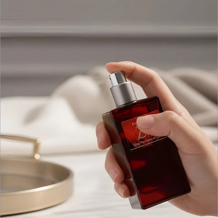 A sleek rectangular red glass perfume bottle with silver spray nozzle from next z plus korean skin care collection