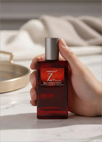 A sleek rectangular deep red glass bottle of Next Z+ eau de perfume with silver cap for korean skin care and perfume use