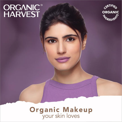Model applying Organic Harvest Midnight Kohl - Intense Black Waterproof Kajal Pencil along the waterline.