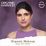 Model applying Organic Harvest Midnight Kohl - Intense Black Waterproof Kajal Pencil along the waterline.