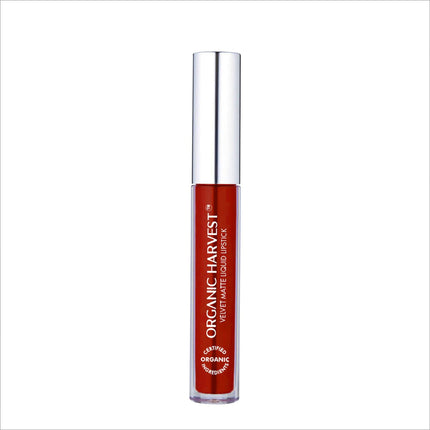 User holding Organic Harvest Velvet Matte Liquid Lipstick, illustrating its appeal as a popular organic liquid lipstick alternative.