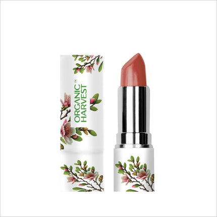 Flat lay of Organic Harvest Moisture Matte Lipstick - Beetroot Red surrounded by makeup essentials, showcasing this essential organic matte lipstick.
