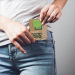 User placing Origami Good Karma 3 Ply Eco-Friendly Unbleached Pocket Tissue in pocket, demonstrating its compact design ideal for on-the-go use. Experience convenience with our 3 ply tissue pack, available at IKONIC NO COD, new, VEGA NO COD.